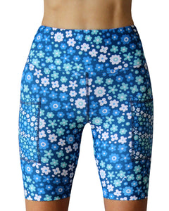 Funky blue flower Tech Shorts for running road and trails, and gym workouts. Made in Cape Town, South Africa. High waist, cellphone pockets, gusset and UPF30+.